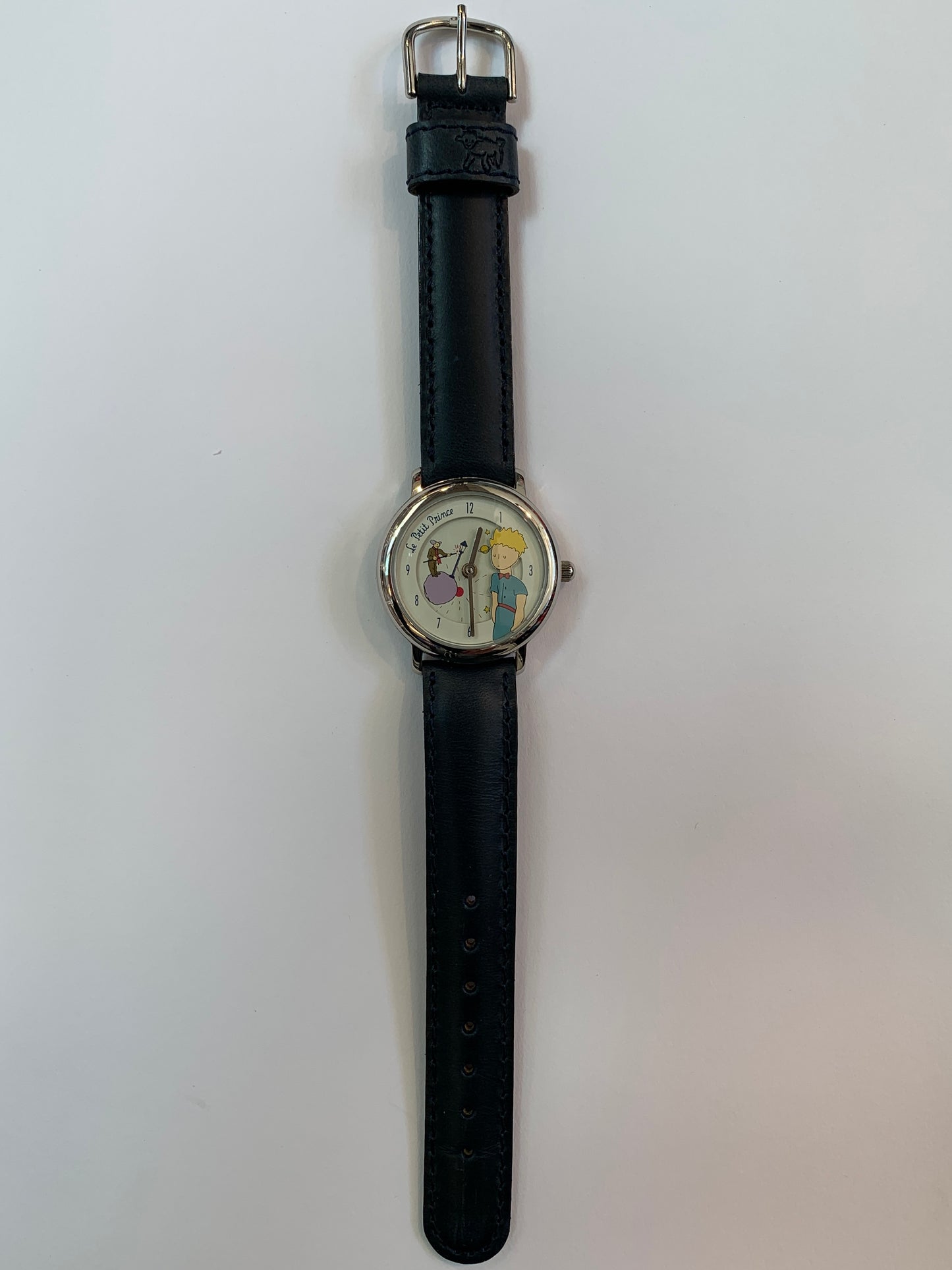 Le Petit Prince Lamplighter limited edition watch with navy blue leather band, stainless steel case, and rotating disc feature