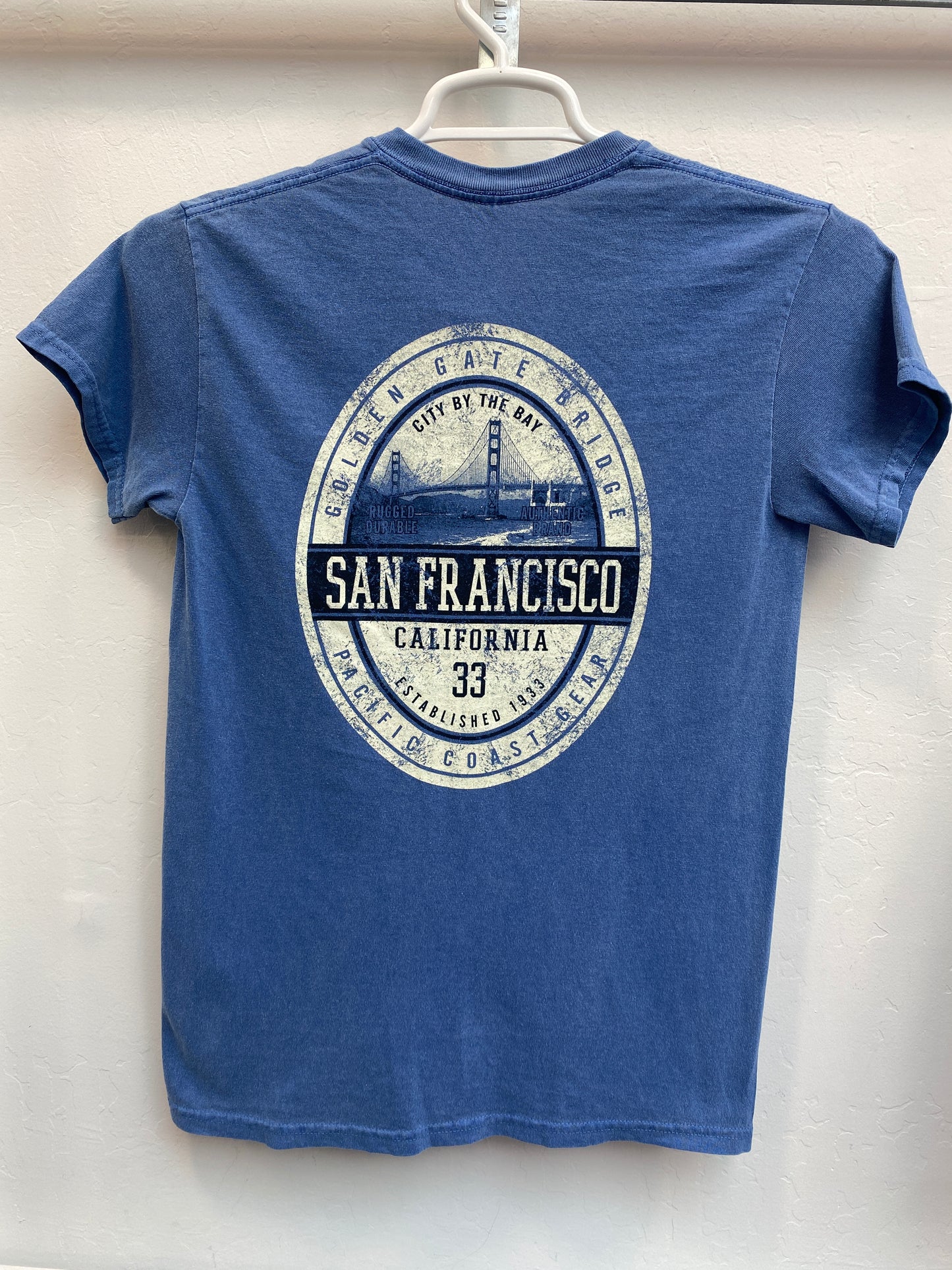 Blue t-shirt with distressed San Francisco Golden Gate Bridge design, featuring city skyline and "Established 1833" text