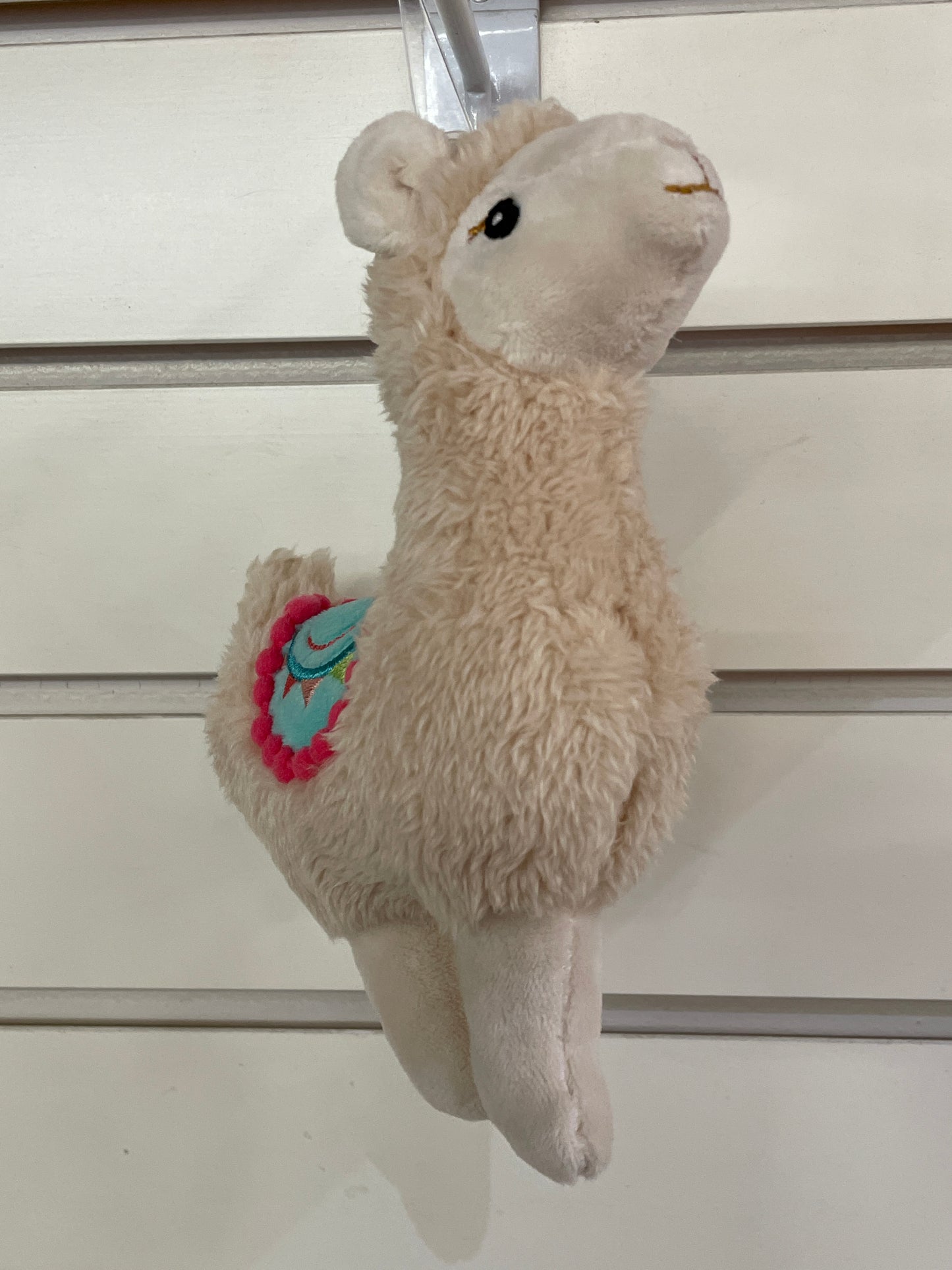 Colorful plush llama baby rattle with embroidered details and pom-pom trim, perfect for small hands to grasp and shake