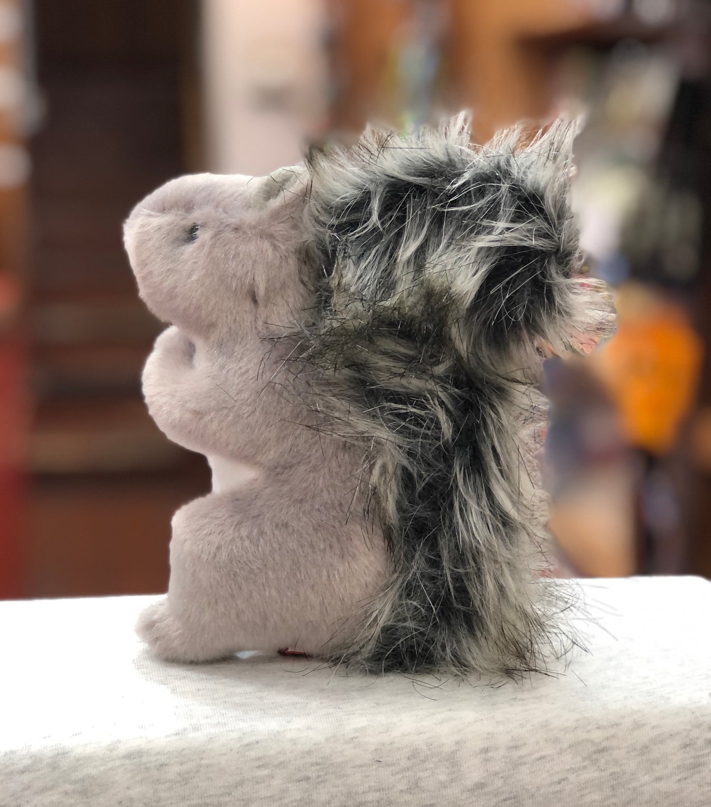 Soft gray squirrel plush toy with fluffy black-tipped tail, sitting upright in alert pose, realistic 6-inch stuffed animal