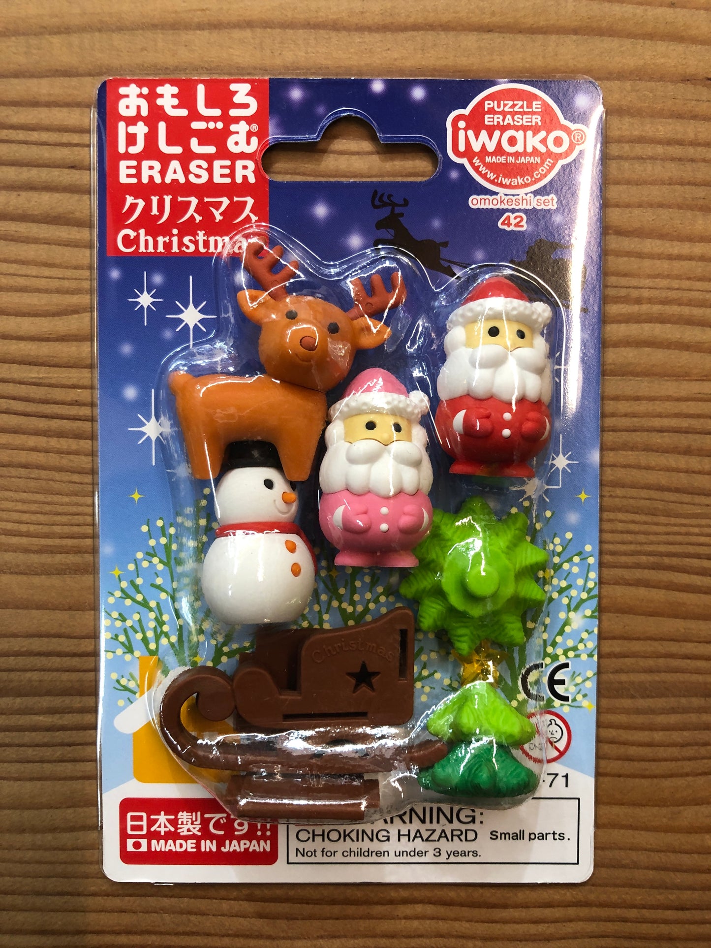 Japanese Christmas eraser set with reindeer, Santa, snowman, sled, and tree figures. Iwako puzzle erasers made in Japan.