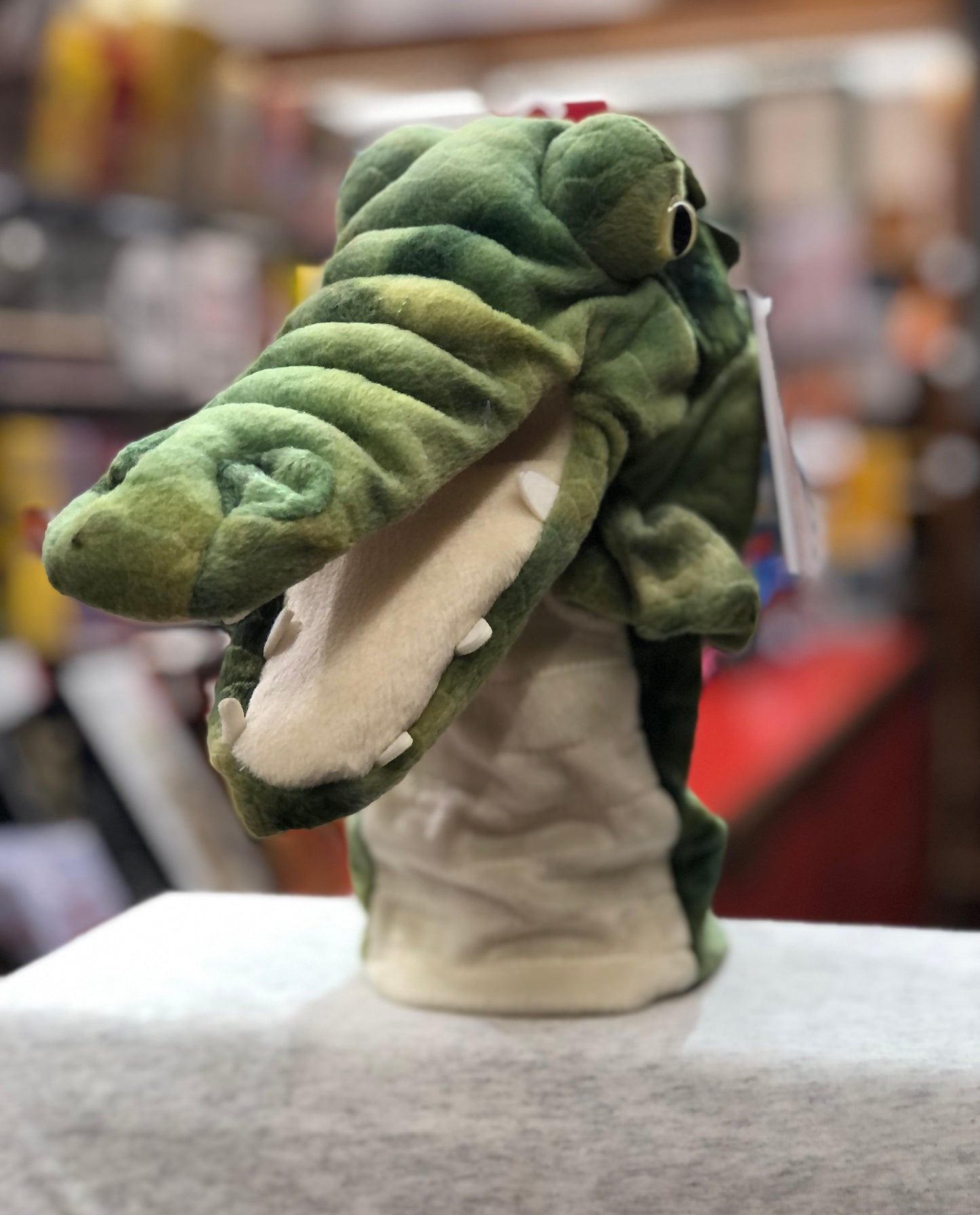 Plush green crocodile hand puppet from The Puppet Company's CarPets collection, designed for family entertainment during car journeys