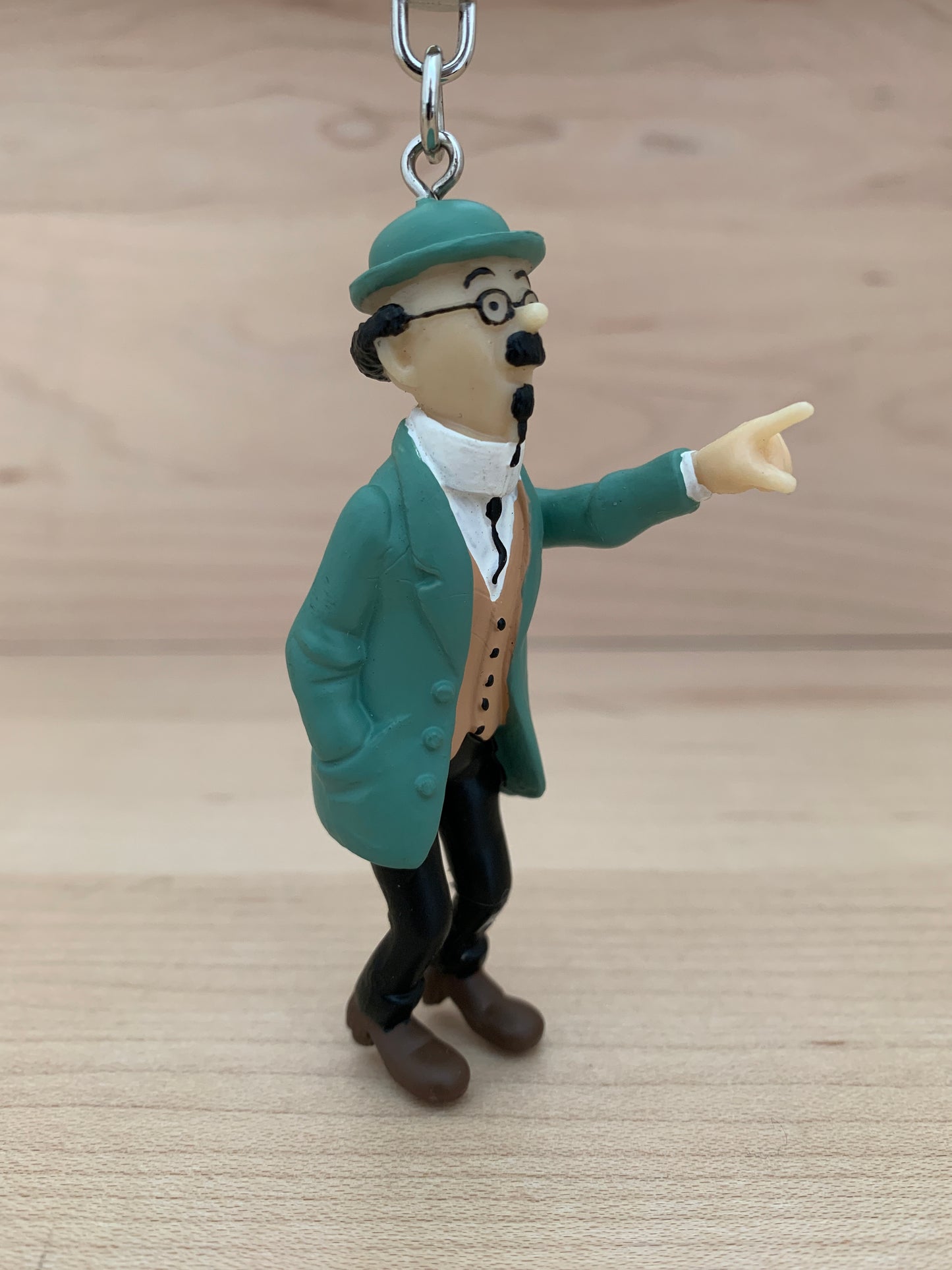 Professor Calculus keychain figure in green coat and hat, pointing with outstretched arm, 7cm PVC miniature with snap hook
