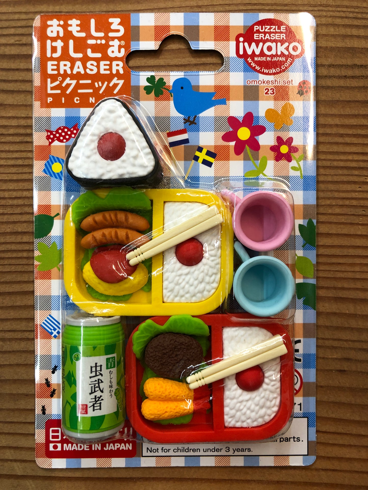 Japanese picnic eraser set with bento boxes, onigiri, soda can, and cups on colorful packaging, made by Iwako