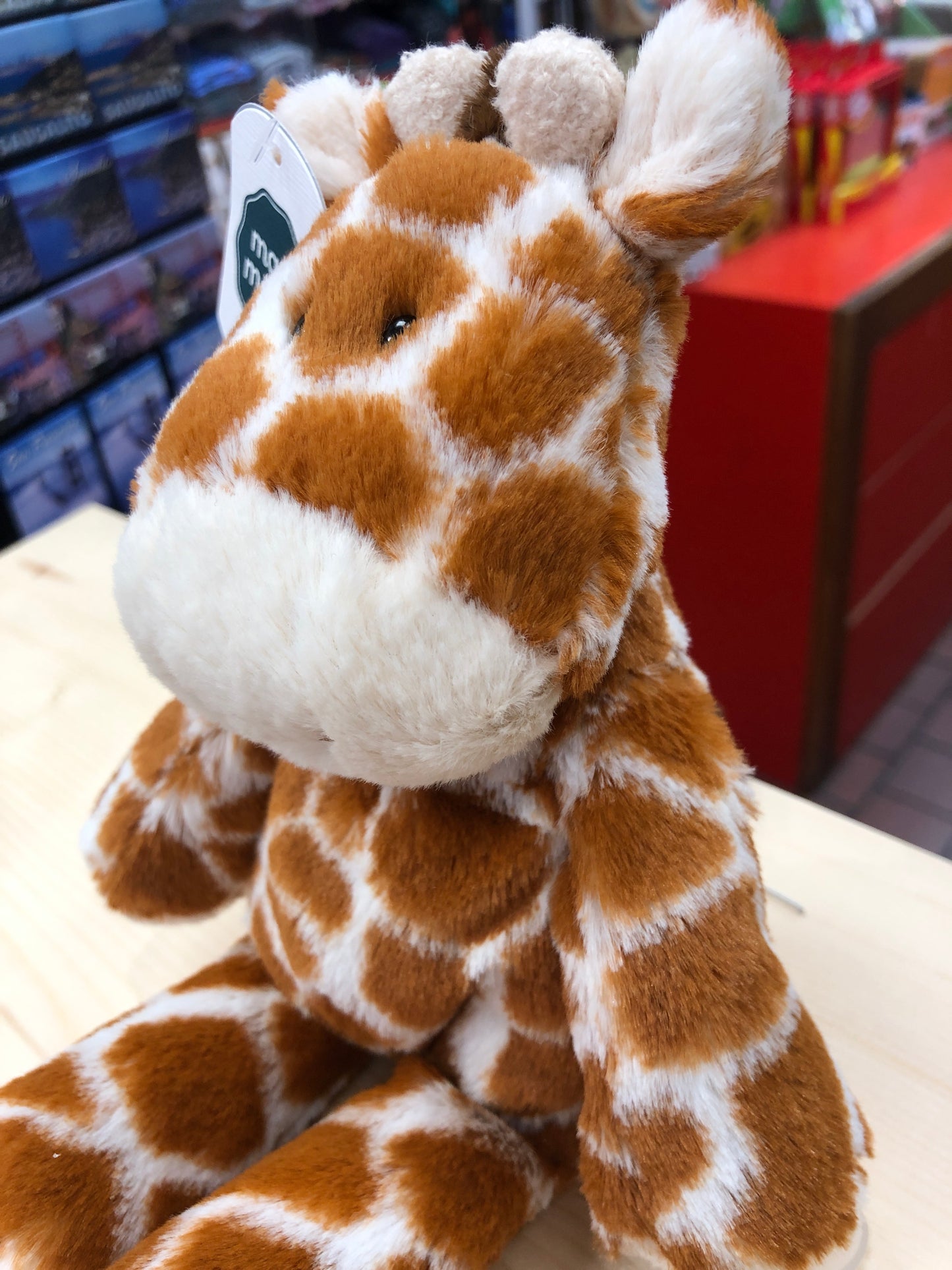Soft, cuddly 9-inch giraffe plush toy from Mary Meyer Marshmallow Zoo, with brown and white spotted pattern, perfect for snuggling