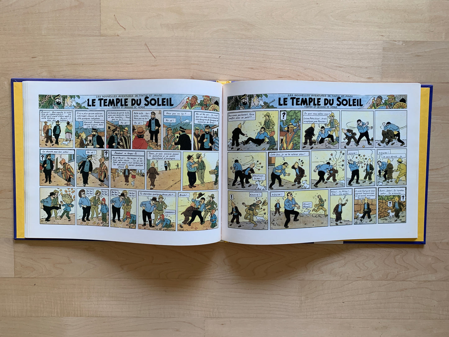 Open Hergé's "Le Temple du Soleil" comic book showing colorful panels from the original 1988 Casterman edition