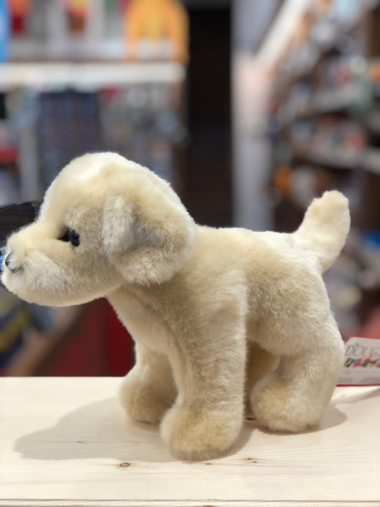 Cuddly 10" Yellow Lab plush toy Zach standing on display, soft cream fur and expressive eyes, perfect for hugs and adventures