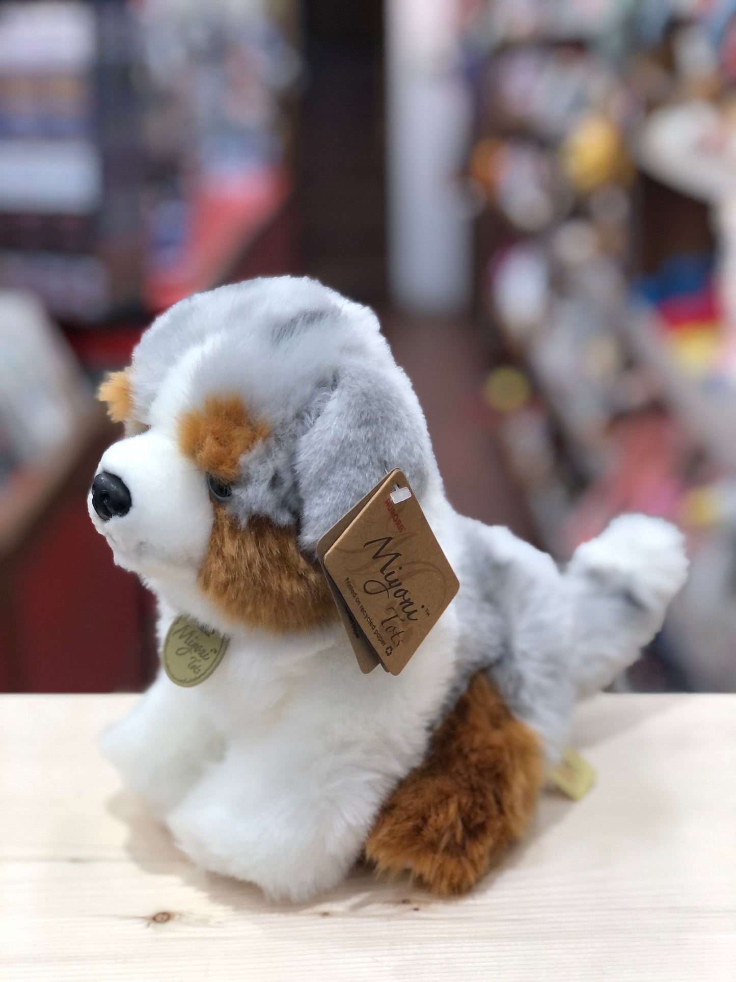 Realistic Aurora Miyoni Tots Australian Shepherd puppy plush toy with mixed color coat and Miyoni tag