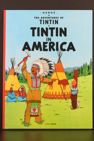 Book cover of "Tintin in America" showing Native American scene with teepees and characters in traditional dress
