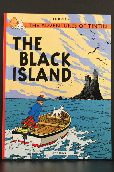Cover of Tintin's "The Black Island" adventure book, showing Tintin and Snowy in a boat approaching a mysterious island
