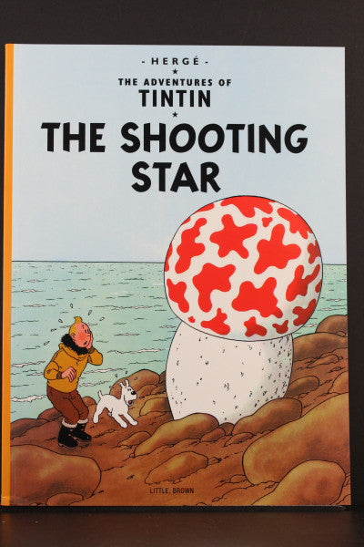 Tintin book cover: "The Shooting Star" featuring Tintin and Snowy observing a giant red-spotted mushroom by the sea