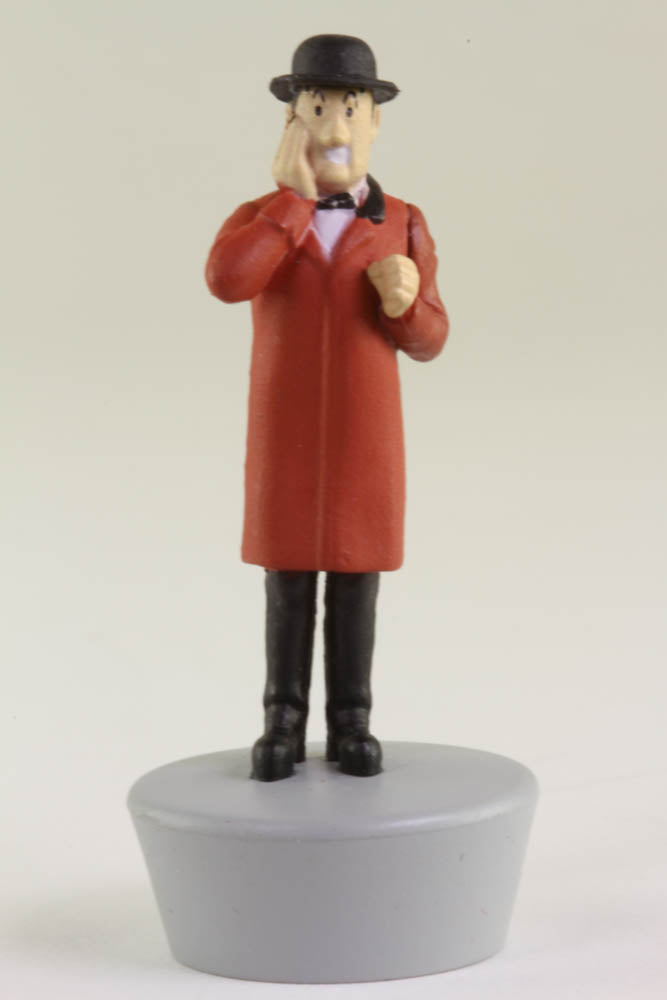 Nestor figurine from Tintin's Seven Crystal Balls, wearing red coat and bowler hat, standing on gray base