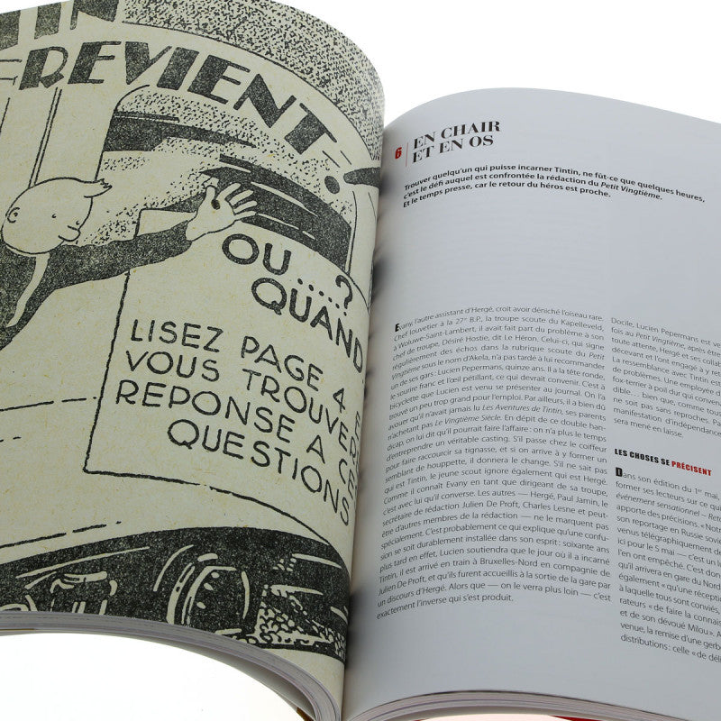 Open book showing early Tintin comic art and French text about Hergé's creative process for "Tintin in the Land of the Soviets"