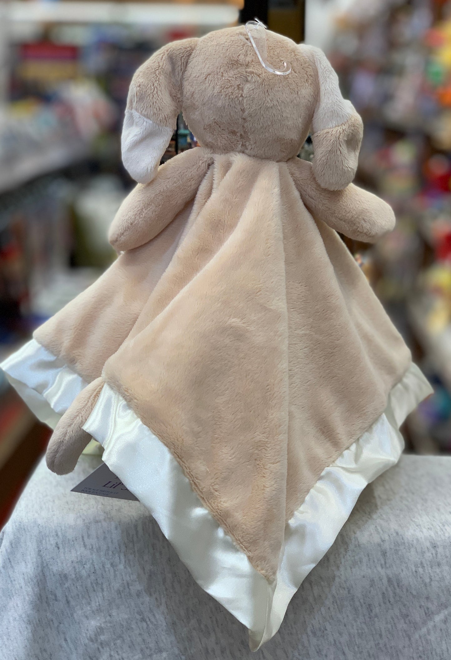 Soft tan puppy plush snuggler with satin trim, embroidered details, and paw print. Infant-safe Douglas Baby toy for cuddles and comfort.