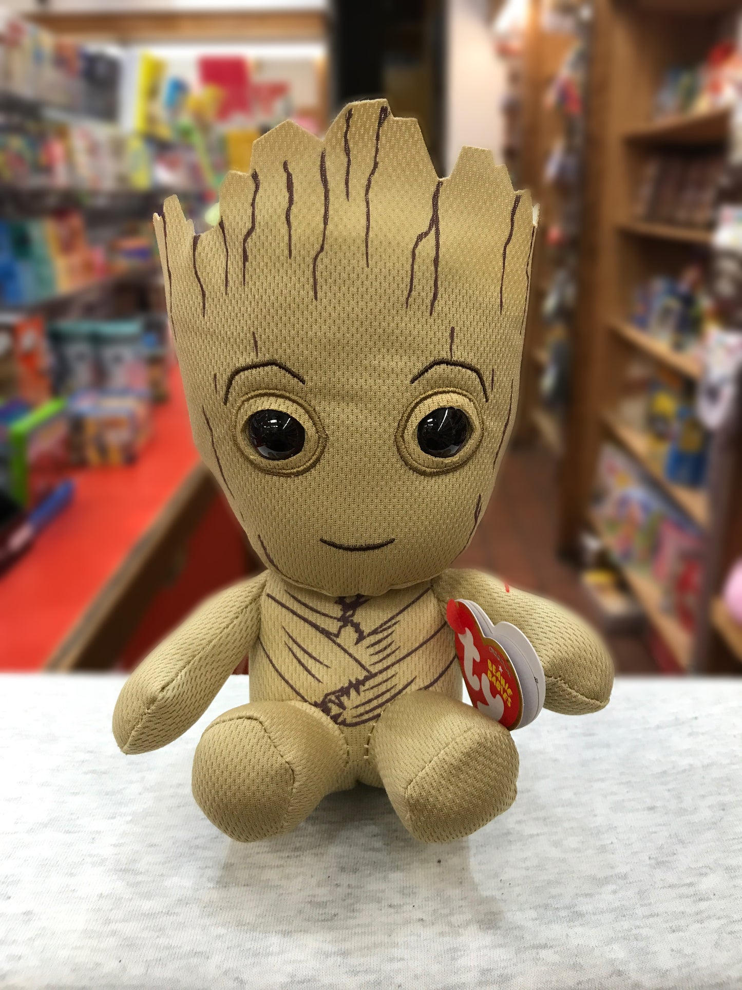 Ty Beanie Baby Groot plush toy from Guardians of the Galaxy, sitting on display in a toy store