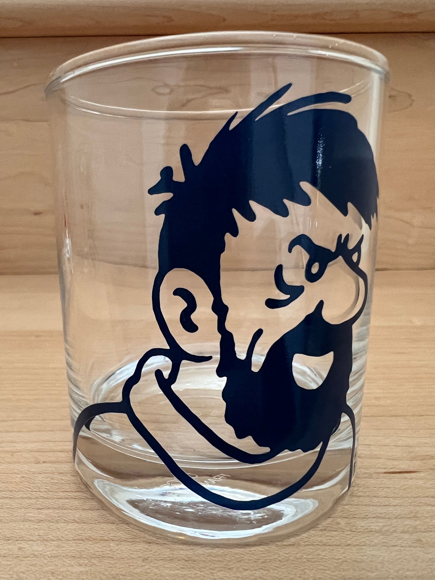 Glass tumbler with Captain Haddock silhouette from Tintin series, part of 4-piece character set by Arcoroc