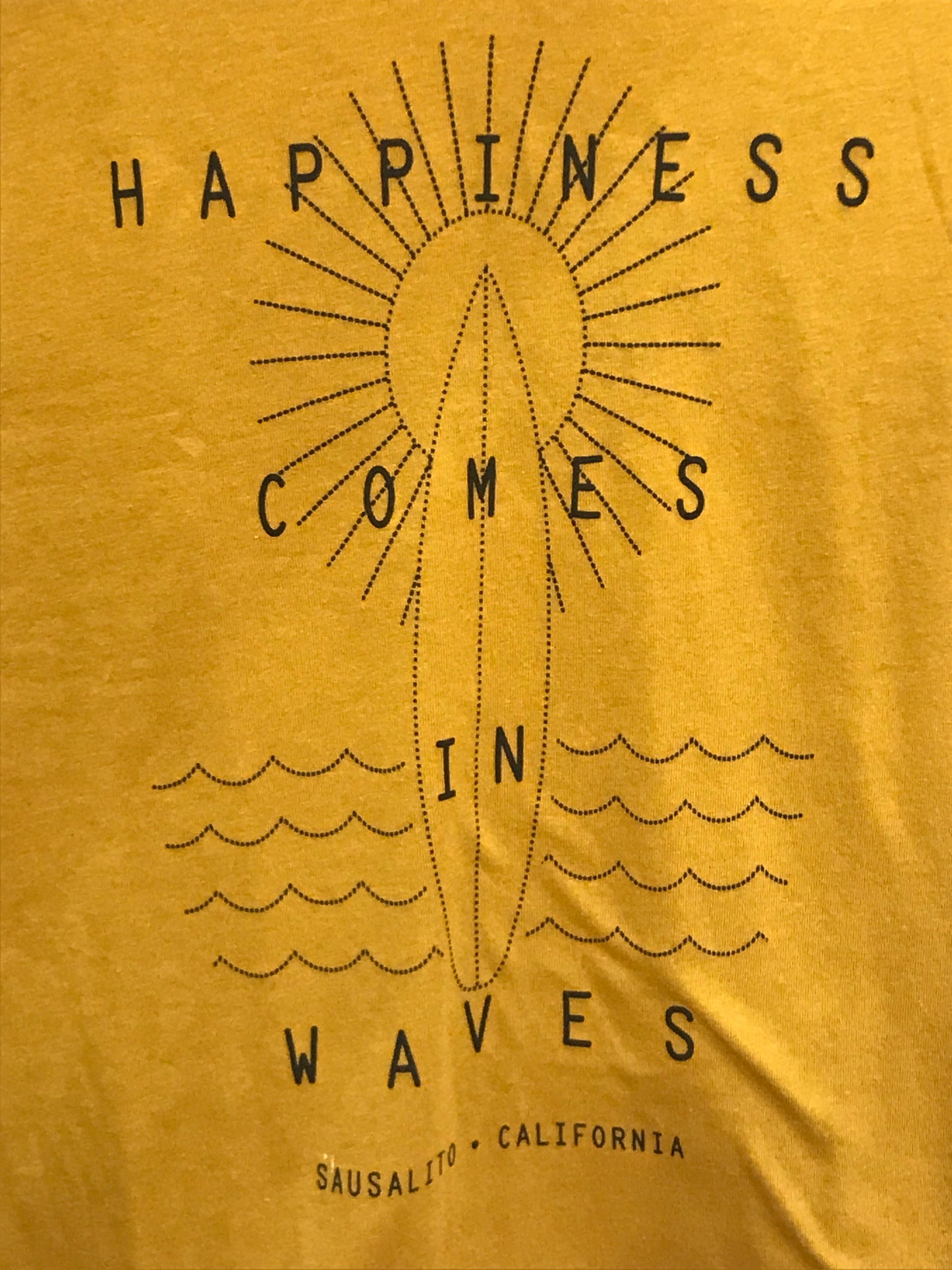 Sausalito Happiness Waves t-shirt design with dotted sun, surfboard, and waves on yellow background