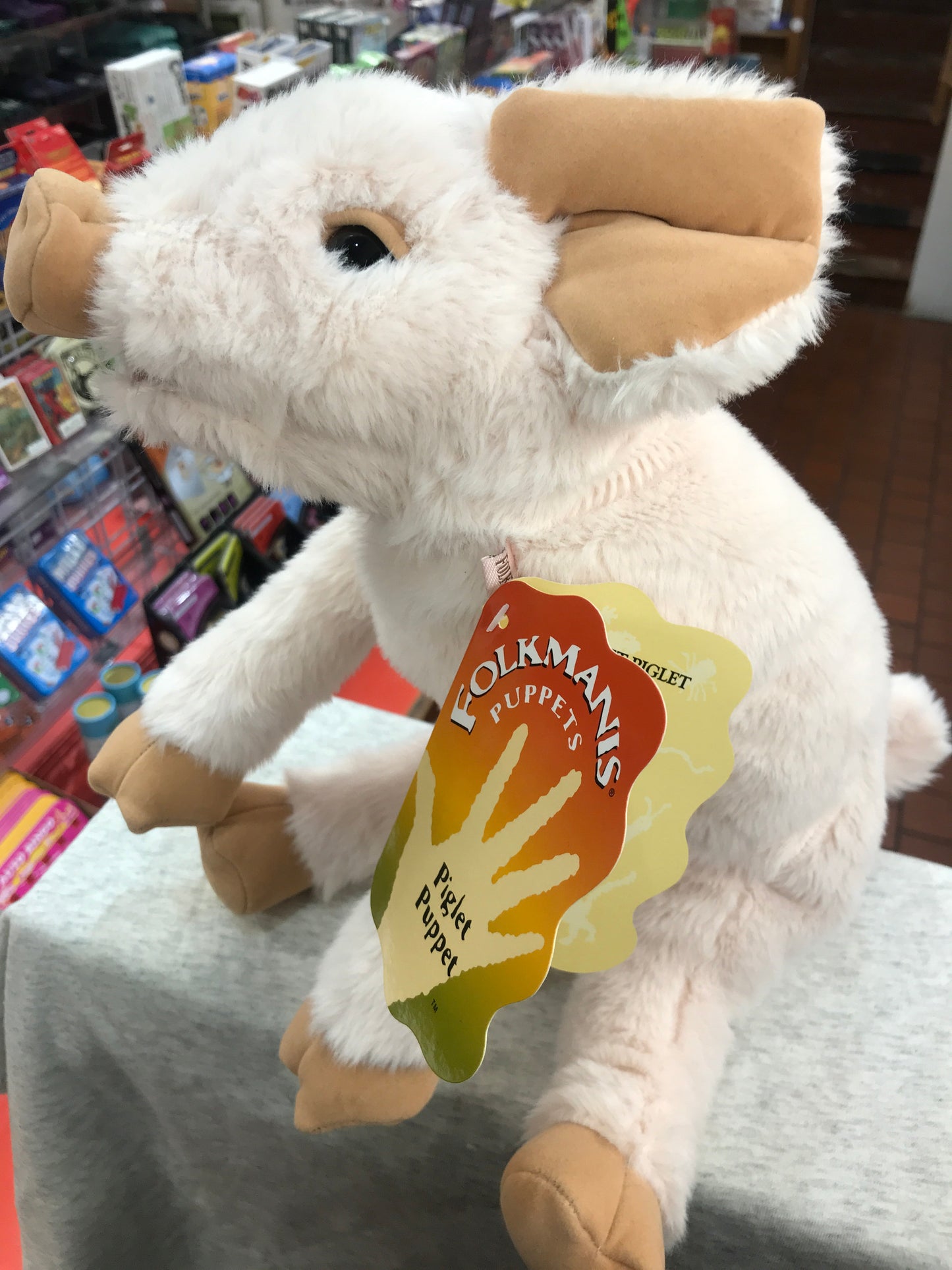 Folkmanis Piglet Puppet, 15 inches long, soft white plush with smiling face and curly tail, perfect for interactive play and snuggling