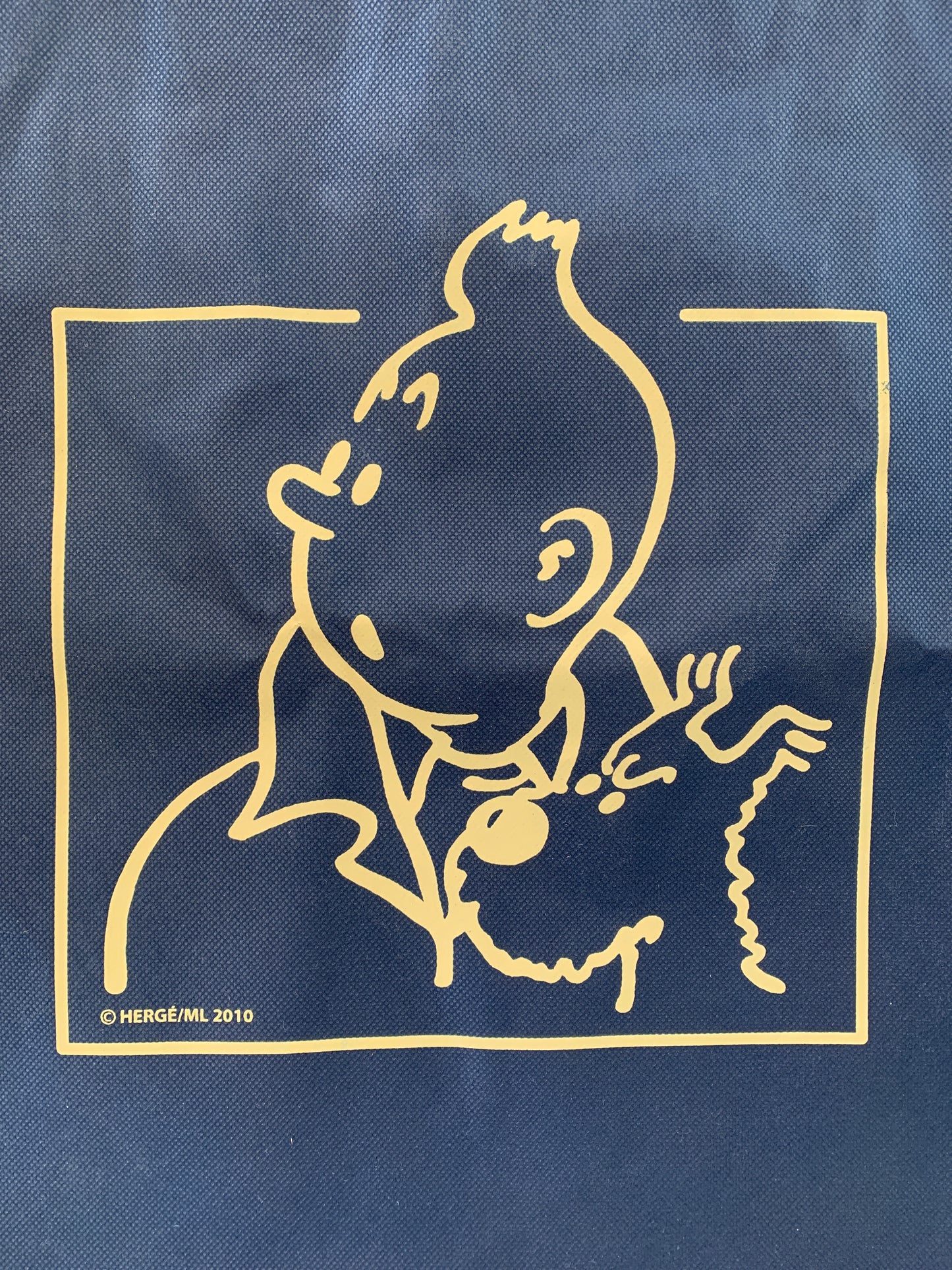 Tintin recycled plastic blue tote with yellow cartoon character design, featuring dual handle sets for versatile carrying options