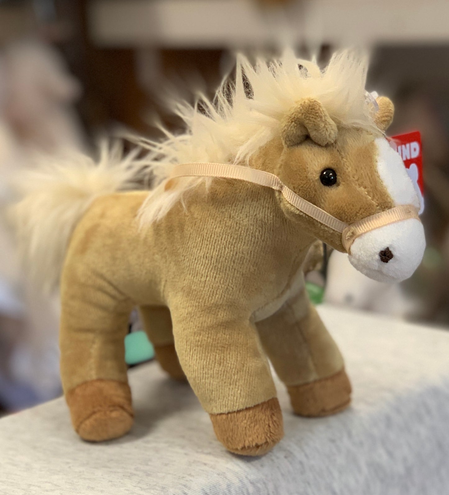 Gund 4.5" tan plush horse toy with fluffy mane, realistic features, and sound-making capability for toddlers