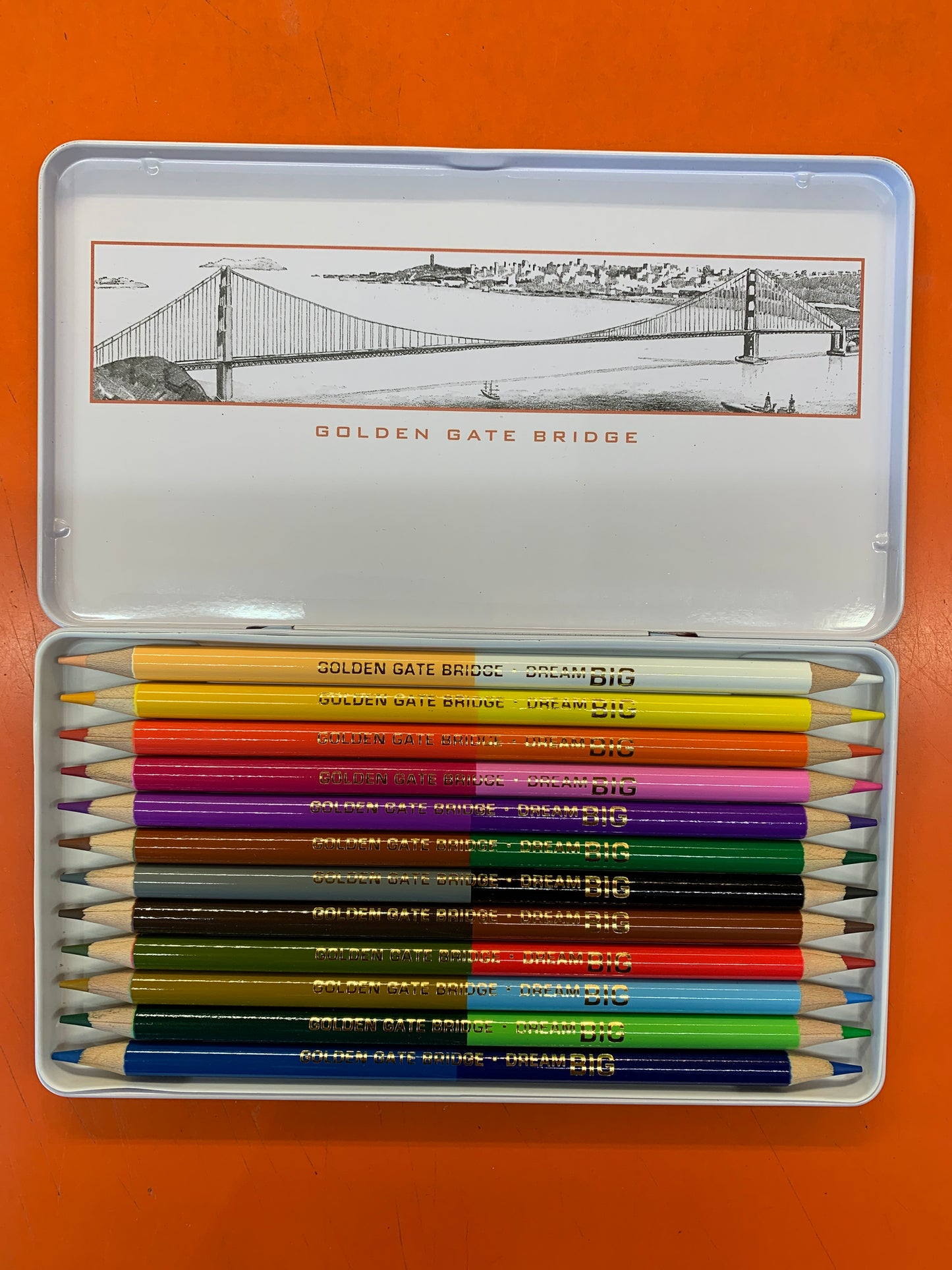 Golden Gate Bridge Dream Big pencil set in metal box featuring 12 dual-color pencils and bridge illustration on lid