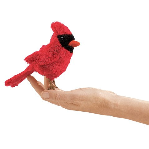 Folkmanis mini cardinal finger puppet perched on hand, bright red plush bird with distinctive crest and black face mask