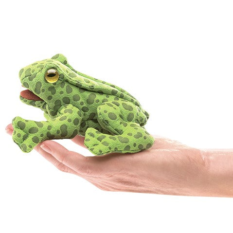 Green spotted Folkmanis frog finger puppet held on palm, showcasing its small 3-inch size and realistic design