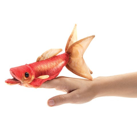 Playful Folkmanis Mini Goldfish finger puppet in bright red and orange, shown on a hand against white background