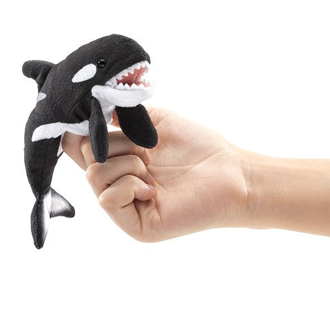 Folkmanis Mini Orca finger puppet in action, plush black and white whale on hand with open mouth, for ages 3+