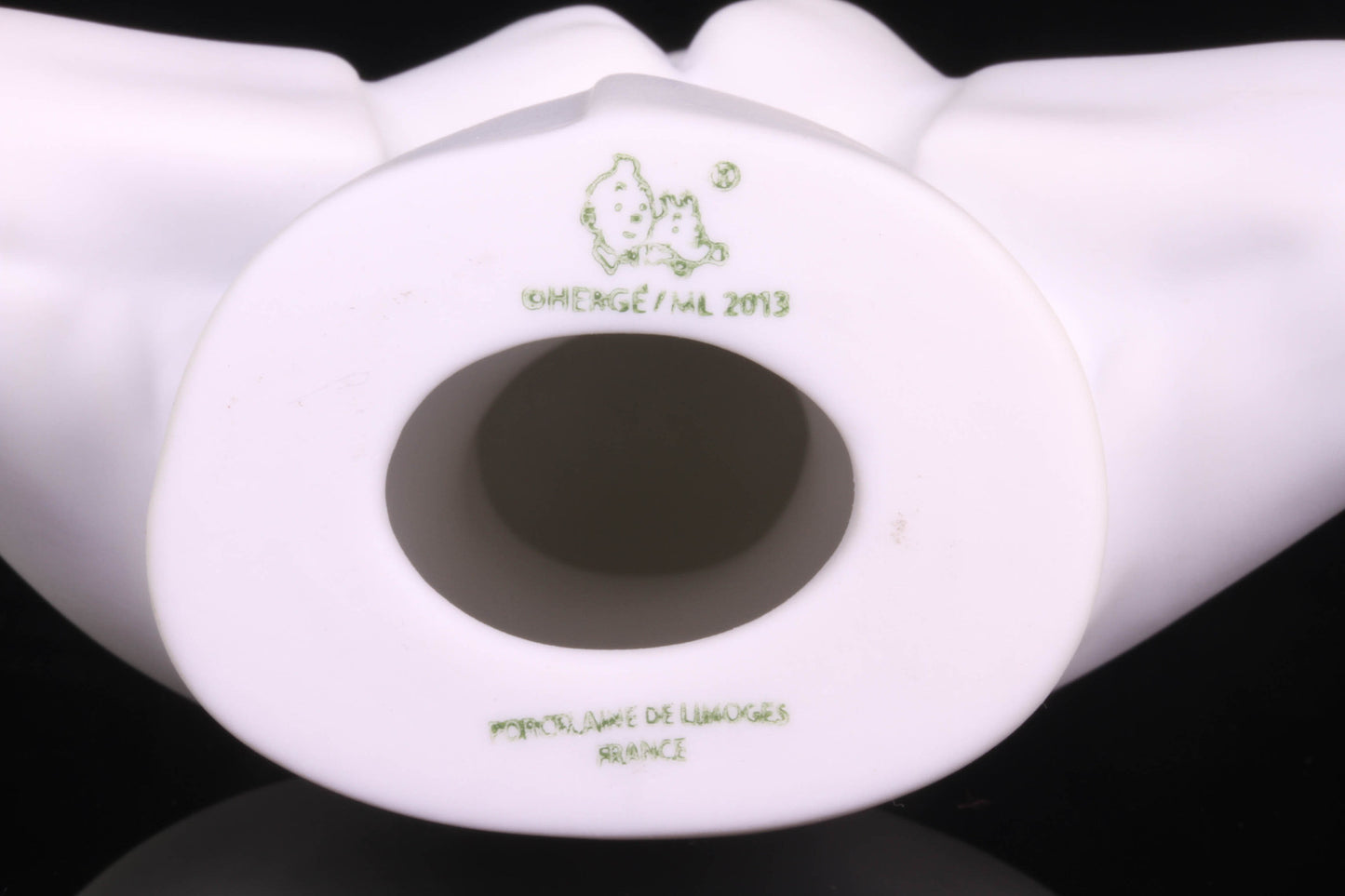 Base of Tintin Limoges porcelain bust, showing maker's mark and 2013 date stamp, limited edition collectible