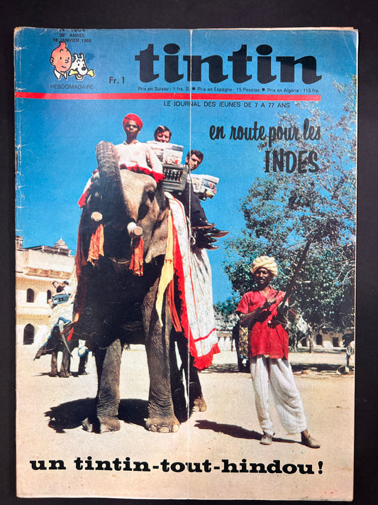 Tintin magazine cover 1968: Tourists on elephant with Indian guide, showcasing journey to India. Vintage comic in worn condition.