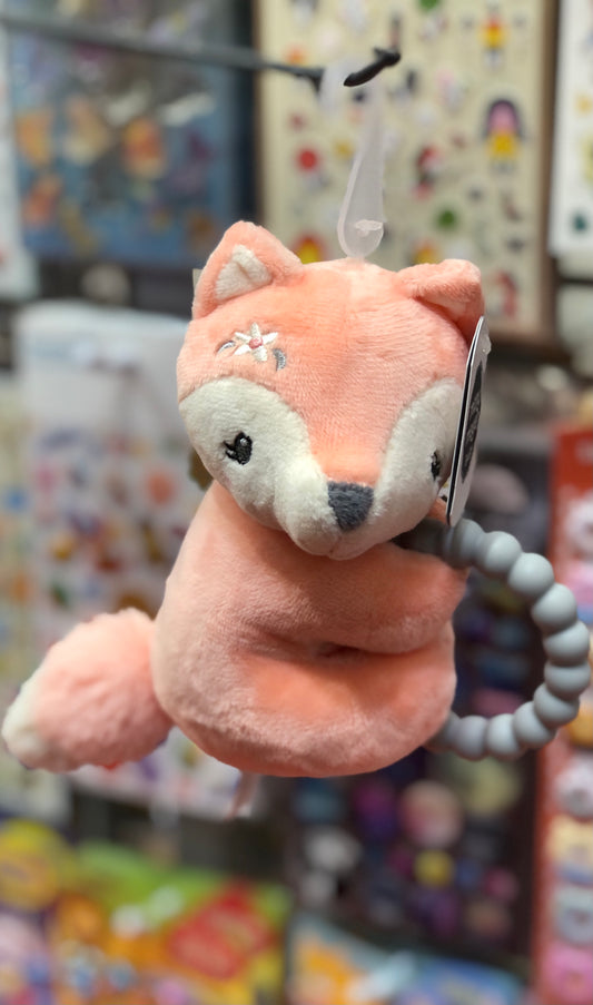 Soft pink fox teether rattle toy with silicone ring, embroidered flower detail, and plush texture for infant stimulation and soothing