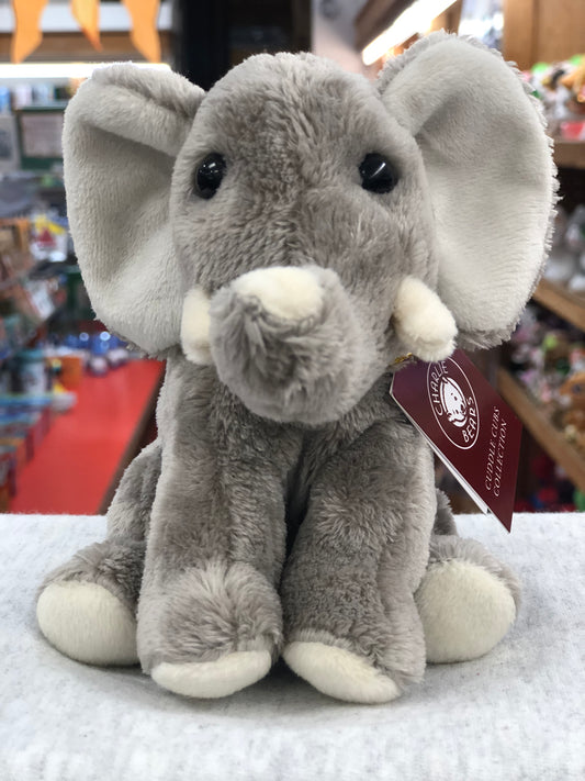 Soft, cuddly Charlie Bears elephant plush toy for babies, with large ears and expressive eyes, displayed in a store setting