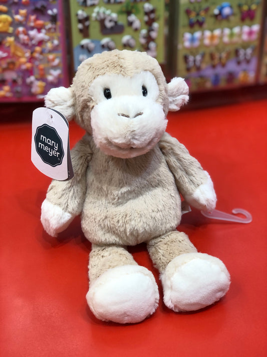 Soft Mary Meyer Marshmallow Zoo Junior Monkey plush toy on red display, featuring beige fur and white accents