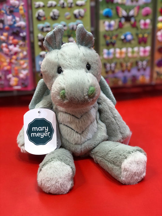 Soft Mary Meyer dragon plush toy from Marshmallow Zoo collection, sitting on red surface with colorful display behind