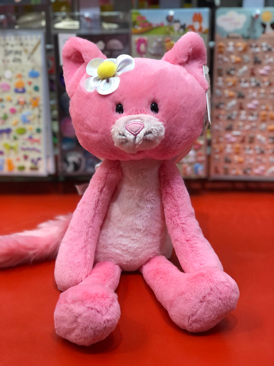 Pink Gund fairy cat plush toy with silver flower, long limbs, and embroidered features on display in toy store