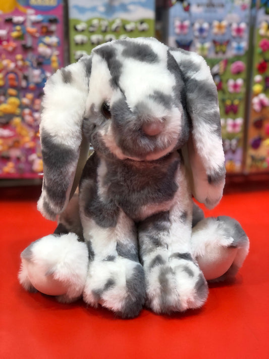Adorable spotted plush bunny with lop ears and oversized paws, soft and posable for imaginative play