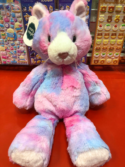 Soft, pastel-colored Mary Meyer Marshmallow Cupcake Kitty plush toy with fluffy fur and embroidered features, displayed among sticker sets