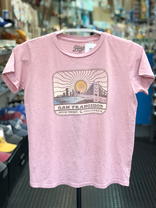 Lake Shirts pink t-shirt with San Francisco graphic design on a hanger in a store.