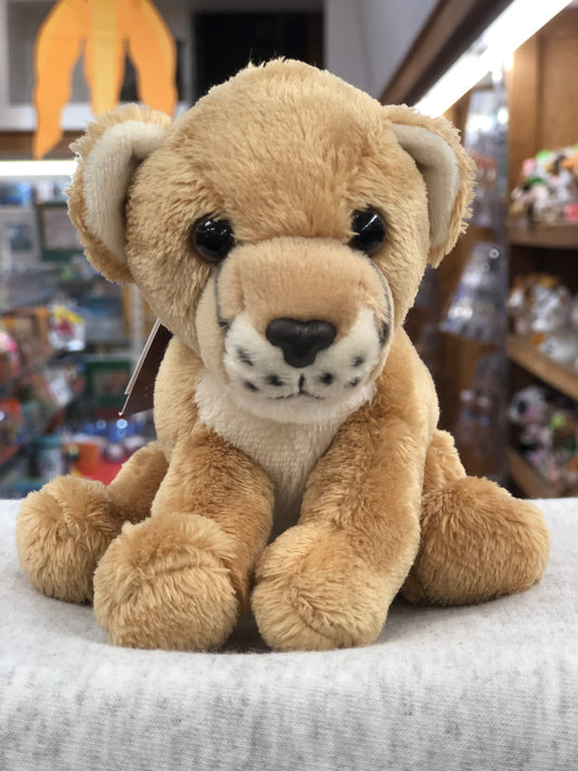 Soft, cuddly Charlie Bears Cuddle Cub Lioness plush toy for babies, featuring big eyes and a detailed face, displayed in a store