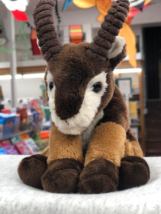 Soft, cuddly Charlie Bears mountain goat plush toy with brown fur and large horns, perfect for babies and toddlers