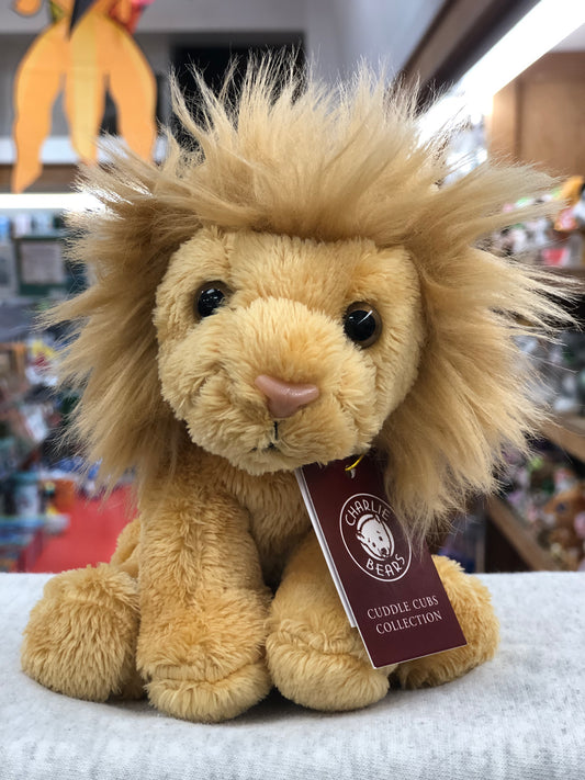 Soft, plush Charlie Bears Cuddle Cub Lion toy with fluffy mane, sitting on display in store, tagged for baby collection