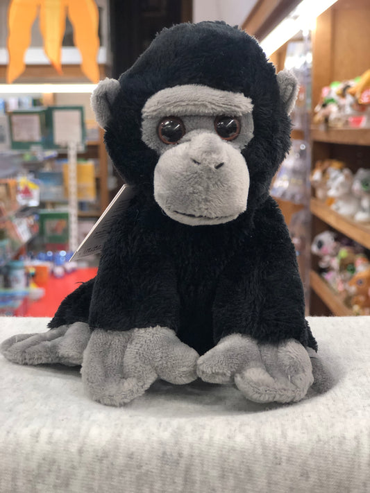 Soft Charlie Bears Cuddle Cub Gorilla plush toy for babies, black and gray, sitting in a toy store display