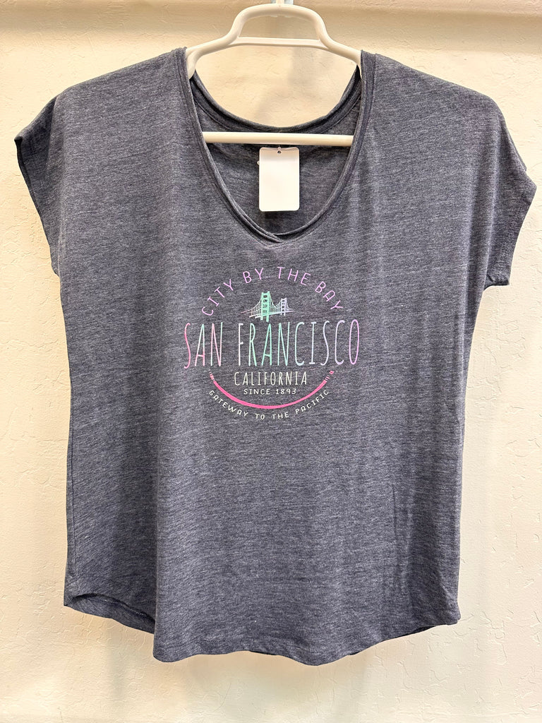 Simple script City By The Bay, San Francisco, California and Gateway to the Pacific comprise the design on this shirt.   Women's V neck shirt is constructed of 50% polyester, 37% cotton and 13% rayon that gives a softness and suppleness to the fabric. Best wearing comfort ever.   Women's sizes small to double extra large.