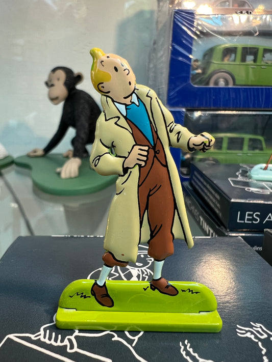 Tintin metal figure from "The Seven Crystal Balls" adventure, with monkey and car models in background