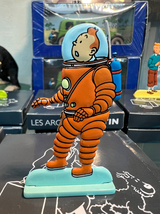 Tintin metal figure in orange spacesuit, exploring moon. Hand-painted collectible from "Explorers On The Moon" series.