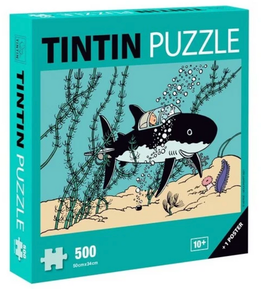 A vibrant teal puzzle box for a 500-piece Tintin puzzle, featuring Professor Calculus's shark-shaped submarine underwater with Tintin inside, maneuvering through tall green seaweed on a sandy ocean floor.