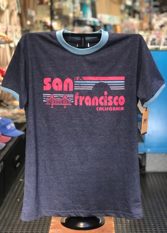 Denim blue unisex t-shirt featuring bold red 'San Francisco California' text, retro horizontal stripes, and a Golden Gate Bridge illustration