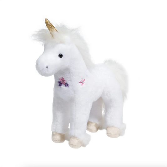 White unicorn plush toy with gold horn, embroidered flowers, and cream hooves, standing upright for display or play