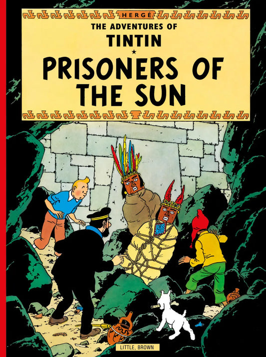 Front cover of 'The Adventures of Tintin: Prisoners of the Sun' paperback book. Tintin and Captain Haddock are seen from behind, looking into a dark cave where Professor Calculus is tied up. Two figures in traditional Incan masks and colorful attire stand guard. The title is prominently displayed on a yellow background.